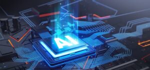 Image of a computer circuit board with a glowing processing chip with the letters AI written on it. The letters are glowing, signifying the artificial intelligence