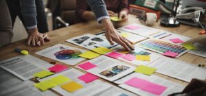 Business people brainstorming what to put in their brand strategy document